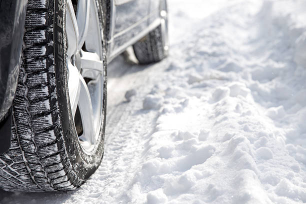 istock Driving car in winter with much snow 484716674