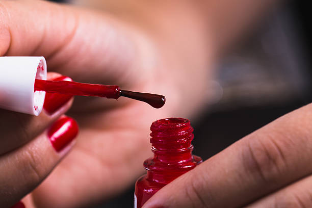 istock Manicure - Beautiful manicured woman's nails with red nail polis 484716942
