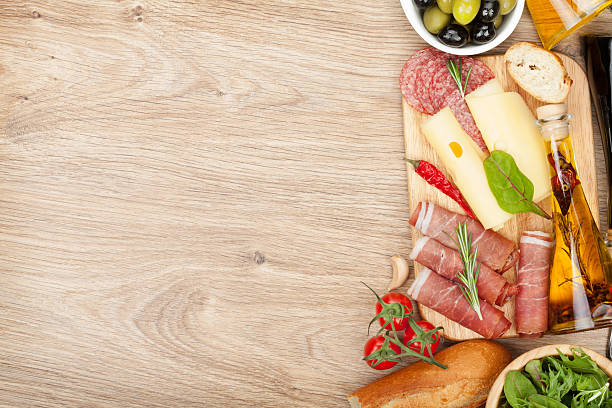 istock Cheese, prosciutto, bread, vegetables and spices 484717799