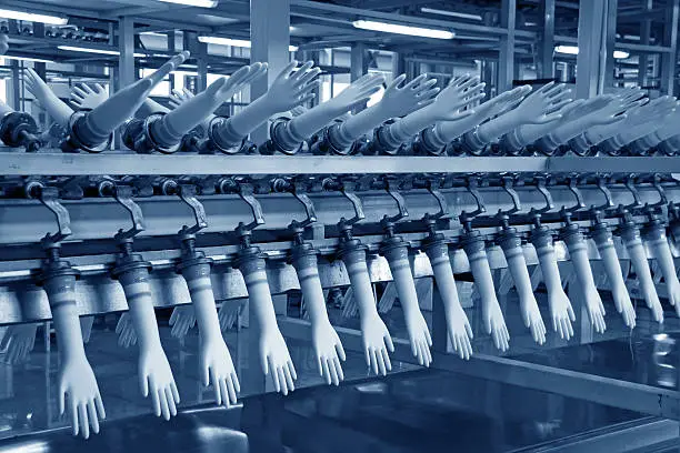 Photo of acrylonitrile butadiene gloves production line in a factory