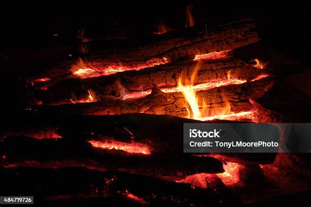 Campfire Burning Very Hot With Flames Between The Logs Stock Photo - Download Image Now