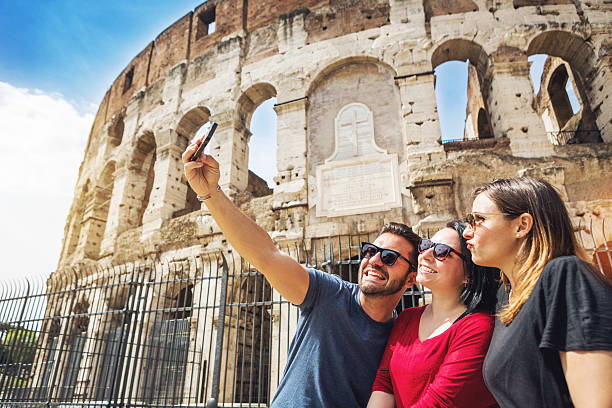 istock Tourists taking a selfie in front of the Coliseum, Rome 484719879