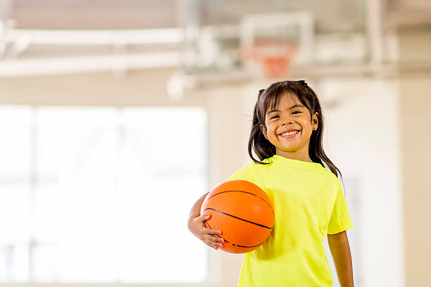 istock Little Girl Playing Basketball 484720000