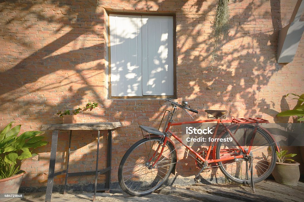Bicycle parking under the shade beside the wall - Royalty-free 2015 Stok görsel