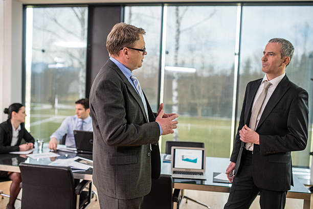 istock Businessmen discussing in conference room 484721896