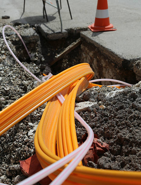road work for the installation of fiber optic cables road work for the installation of fiber optic cables for telecommunications HIGH-SPEED telematics fibre channel stock pictures, royalty-free photos & images