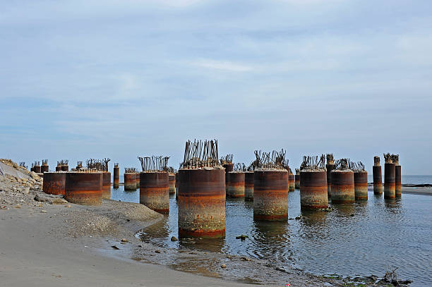istock Concrete pile construction on the surface of the water 484726892