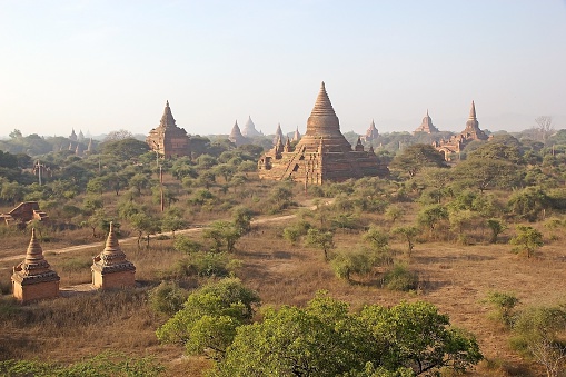 Ruins of Bagan, Bagan, Myanmar. Bagan, located on the banks of the Irrawaddy river, is home of the largest and denset concentration of Buddhist temples, pagodas, stupas and ruins in the world with many dating from 11th and 12th centuries.