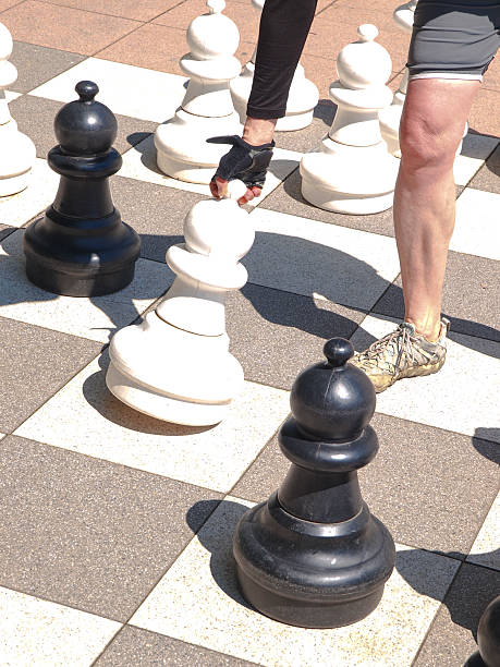istock Biker plying chess in park in Spittal, Austria 484730614