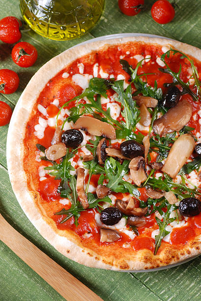 istock Italian pizza with arugula and mushrooms 484730668
