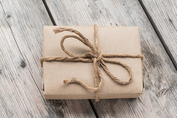 istock Vintage gift box brown paper wrapped with rope 484731408