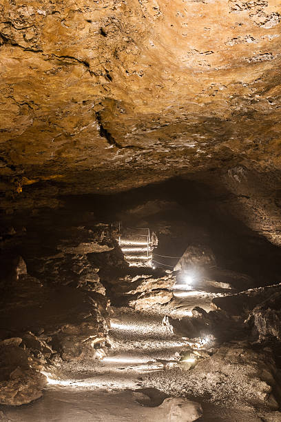 istock Illuminated footpath with railing to visit Caves of La Balme 484731948
