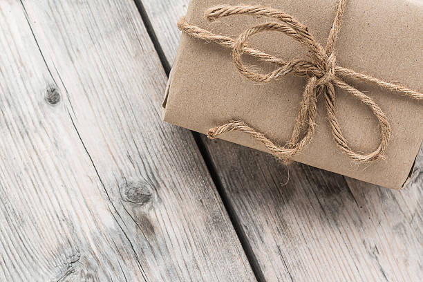 istock Vintage gift box brown paper wrapped with rope 484732026