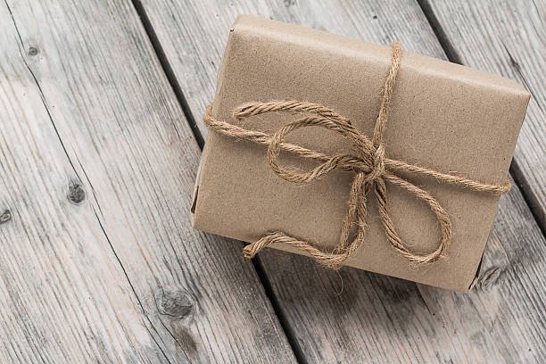 istock Vintage gift box brown paper wrapped with rope 484732028
