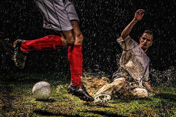 picture of young soccer players playing with the ball on a soccer field