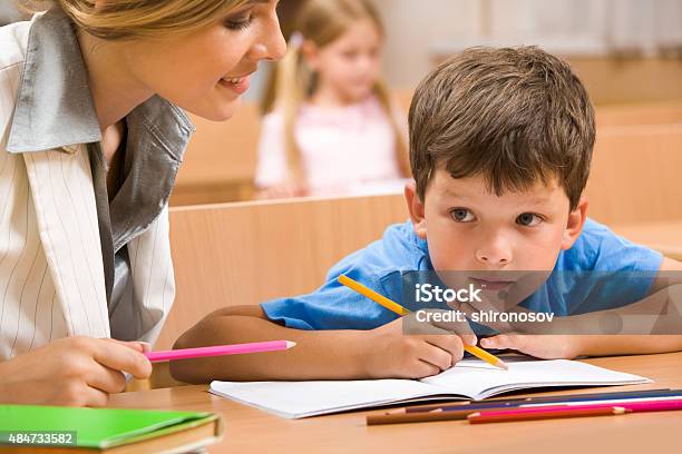 Teacher And Pupil Stock Photo - Download Image Now - 2015, Adult, Book