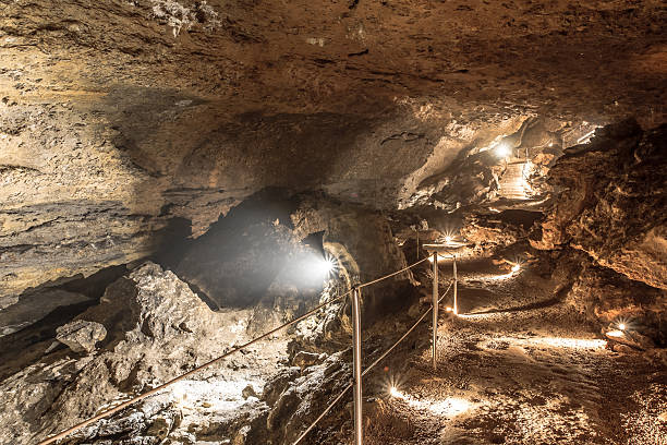 istock Illuminated footpath with railing to visit Caves of La Balme 484733586