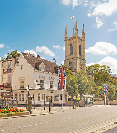 Main street with parish church of St John the Baptist  in Windsor, which is a town in the Royal Borough of Windsor and Maidenhead in Berkshire, England