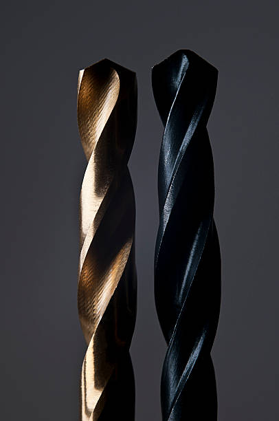 istock Golden and Black Drill Bit on dark background 484735134