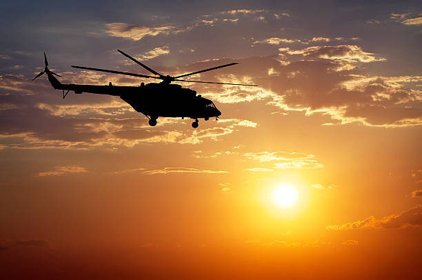 istock Picture of helicopter at sunset. 484738234