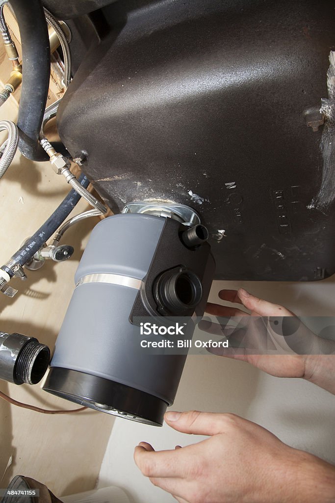 Installing Garbage Installing Garbage Disposal Stock Photo - Download Image Now ...