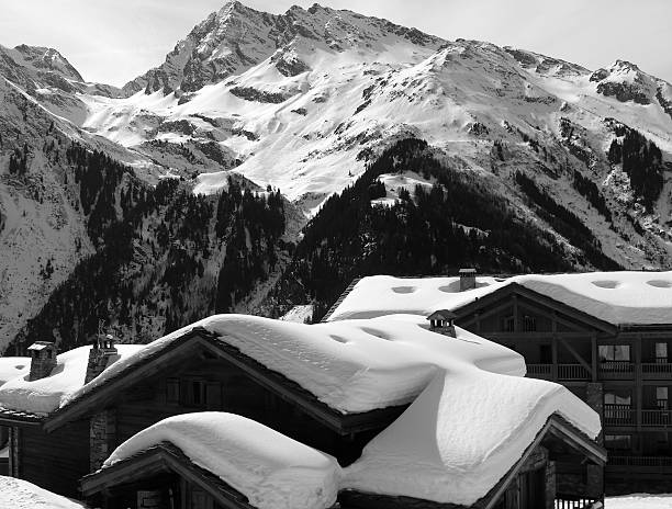 Telephoto B&W image of an elite ski resort in the Alpes, may contain artifacting.