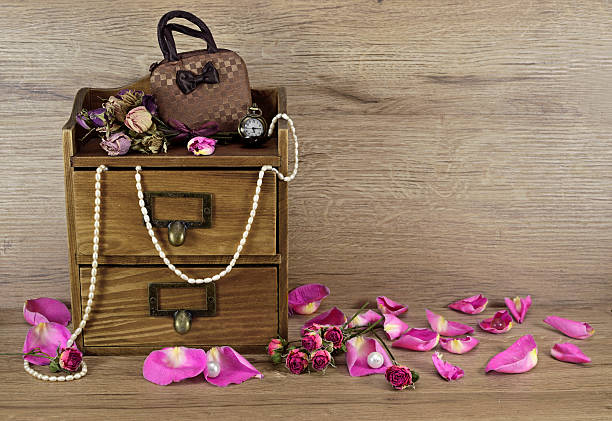 istock Wooden box with rose petals 484743413