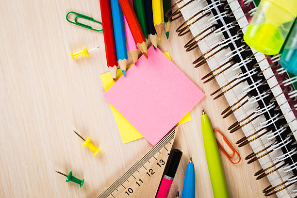 istock School and office accessories on wooden background 484744084