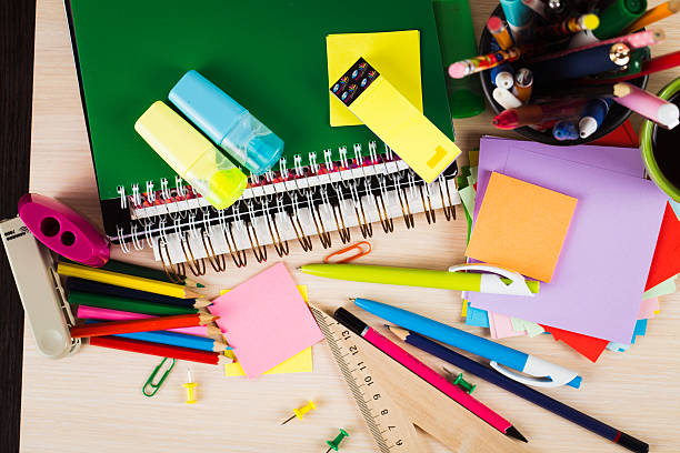 istock School and office accessories on wooden background 484744094