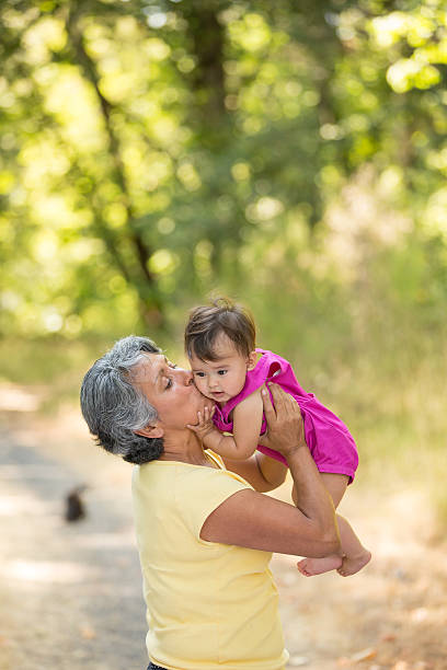 istock Hispanic grandmother spending time with graddaughter in the park 484744346