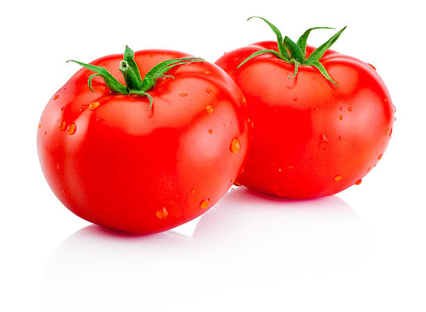 istock Two wet red tomatoes isolated on white background 484744838