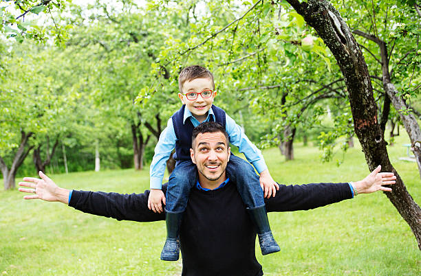 istock Father and son in forest on a meadow 484745096