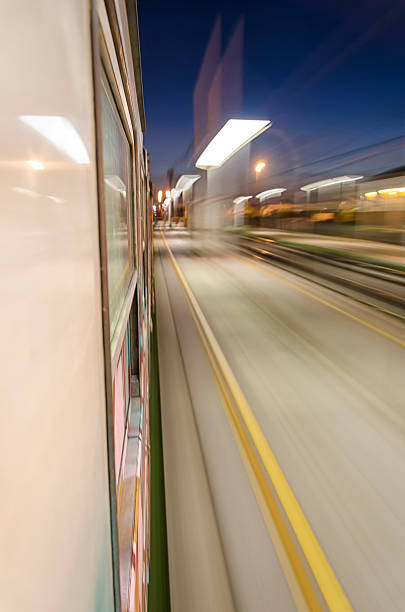 istock Train crossing the station at night 484745514