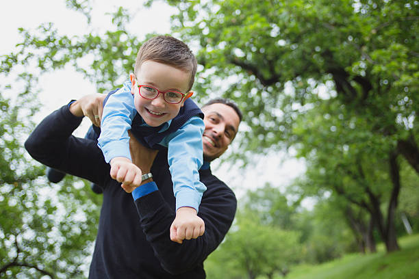 istock Father and son in forest on a meadow 484746604