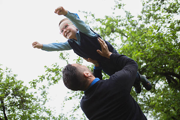 istock Father and son in forest on a meadow 484746610
