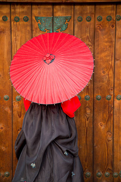 istock Lady with Red Parasol in Hanbok 484748814