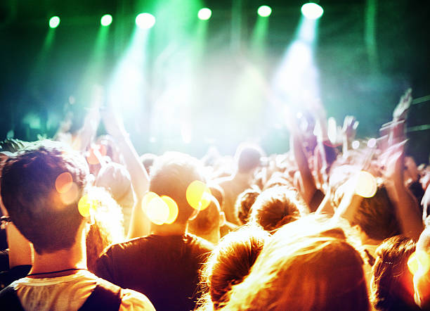 istock People at concert party. 484750040