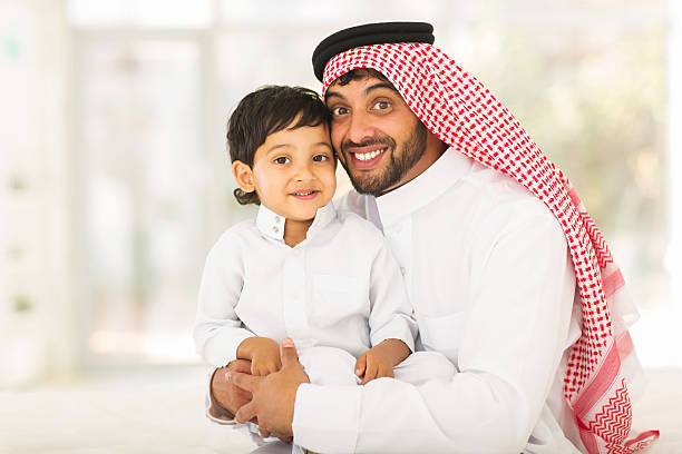 istock muslim father and his little boy 484751148