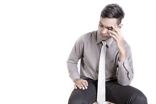 istock Asian business man sitting on a chair over white background 484757548