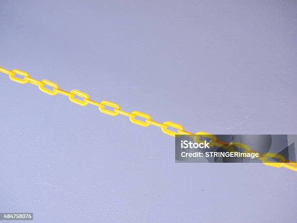 Yellow Chain Barrier On Grey Background Stock Photo - Download Image Now - Chain - Object, Plastic, Yellow