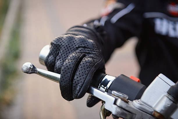 istock protective biker gloves on a motorcycle wheel 484758374