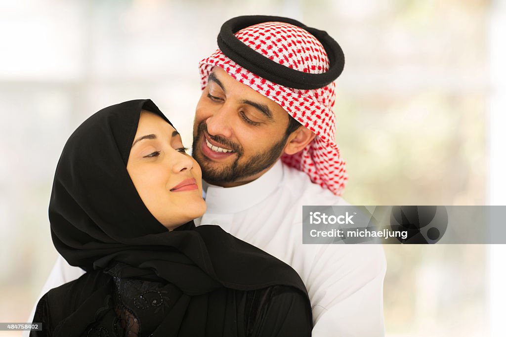 Young Muslim Couple Cuddling Stock Photo - Download Image Now - 2015,  Adult, Adults Only - iStock