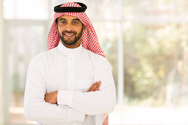 arabian man with arms crossed stock photo