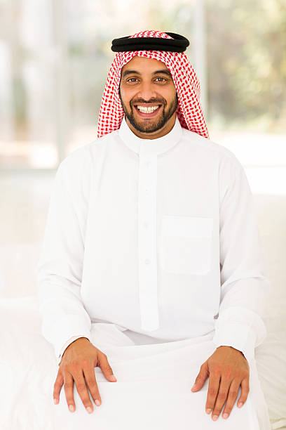 istock young arabian man sitting on at home 484758792