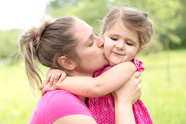 istock Mother and daughter in forest on a meadow 484759054