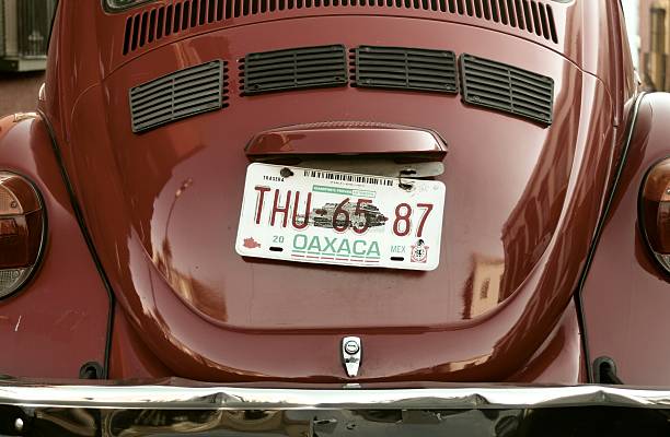 Oaxaca, Mexico - March 9, 2007: Close-up of tailgate and license plate of an old Volkswagen beetle parked in the Mexican city's streets.