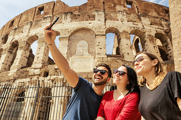istock Tourists taking a selfie in front of the Coliseum, Rome 484760809