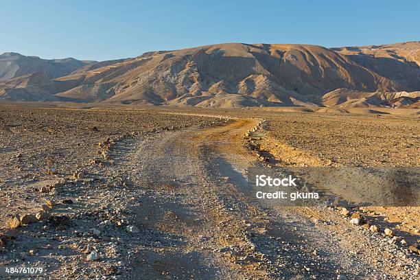 Dirt Road Stock Photo - Download Image Now - Arid Climate, Blue, Boulder - Rock