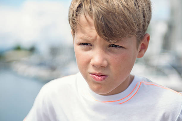 istock Young teen boy standing on the beach 484761362