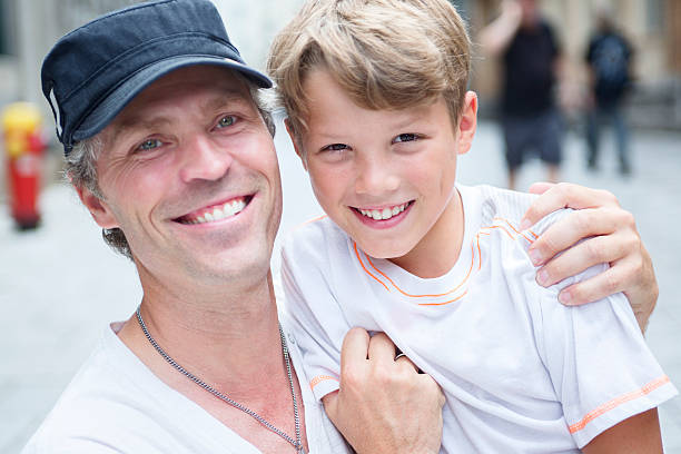 istock son with father in city 484761508